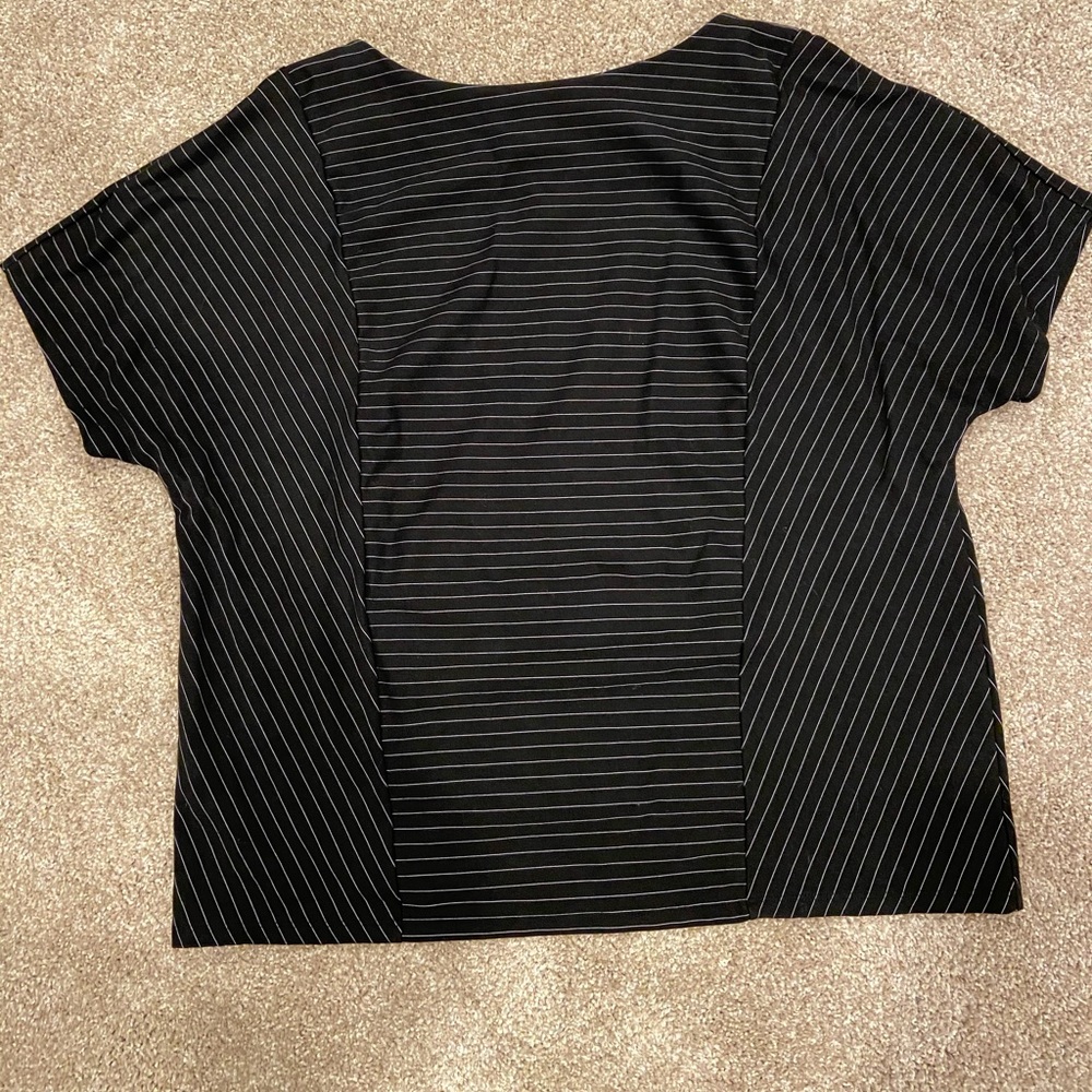 Chico’s top black with thin silver stripes.